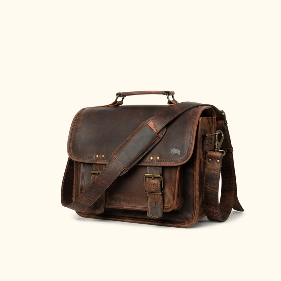 Roosevelt buffalo leather camera bag in dark oak with adjustable strap and antique brass buckles.